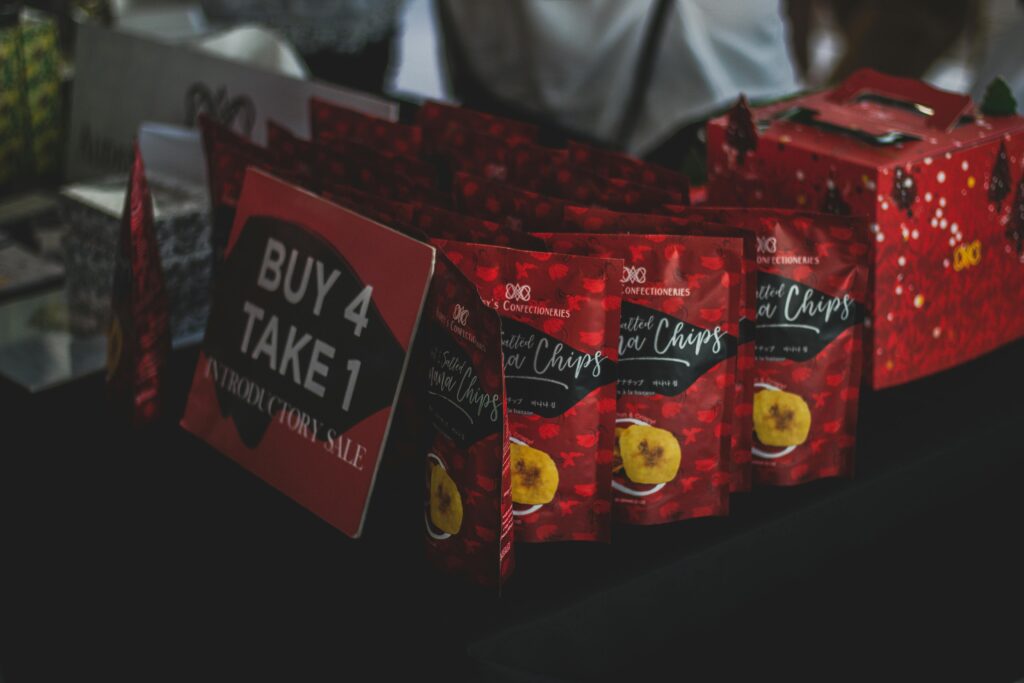 Assorted Chip Packs on Black Surface in Tilt Shift Photography